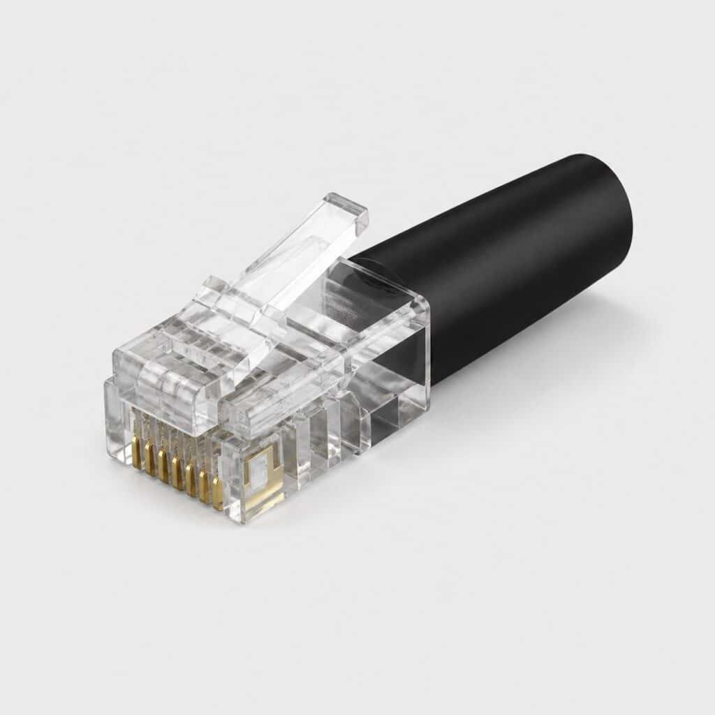 Connecteur reseau translucide a contacts dores sur fond gris tres clair
